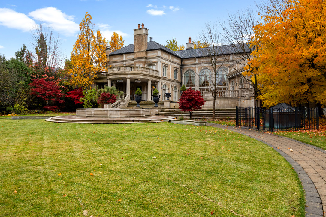 Rosedale Toronto stately limestone heritage residence with mature autumn trees